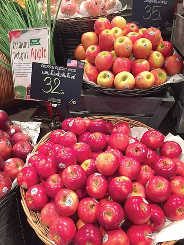 A basket of of WA 2 apples, in the foreground, with the brand of Crimson Delight is displayed in a store in Thailand. (Courtesy Apple King)