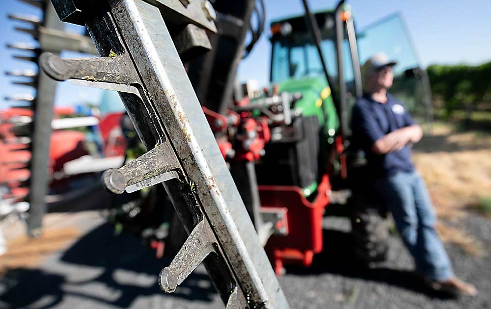 Though the $16,000 attachment was a major purchase for his family, the hedger has paid off with lower labor costs and a more consistent canopy over three years of use. (TJ Mullinax/Good Fruit Grower)