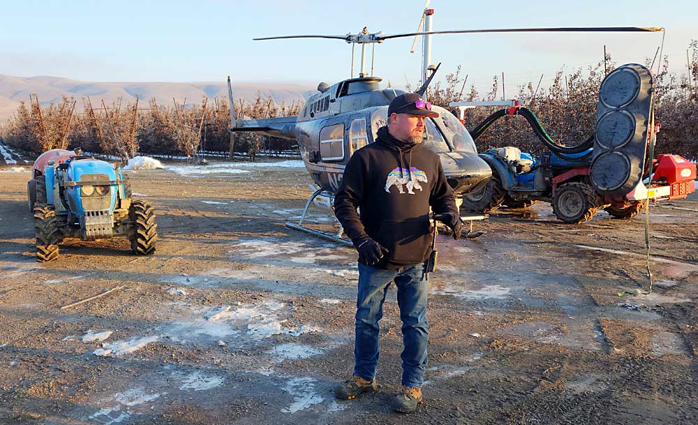 Phil Doornink, a Yakima Valley grower, organized the trial at his farm, testing an orchard sprayer, helicopter and pneumatic leaf blower. (Courtesy Keith Veselka/Courtesy Keith Veselka/NWFM)