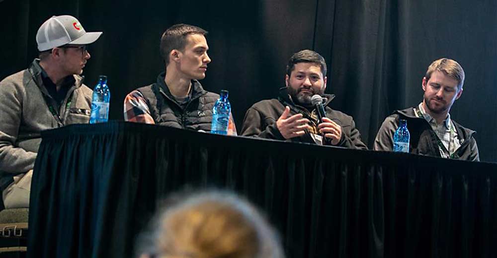 Left to right: Paul Cathcart of Chiawana Orchards, Drew Washut of Allan Bros., Chet Dufault of Emmanuel Enterprises and Gilbert Plath of Washington Fruit and Produce Co. on a panel discussing technology solutions for irrigation at the Washington State Tree Fruit Association Annual Meeting Dec. 5. (TJ Mullinax/Good Fruit Grower)