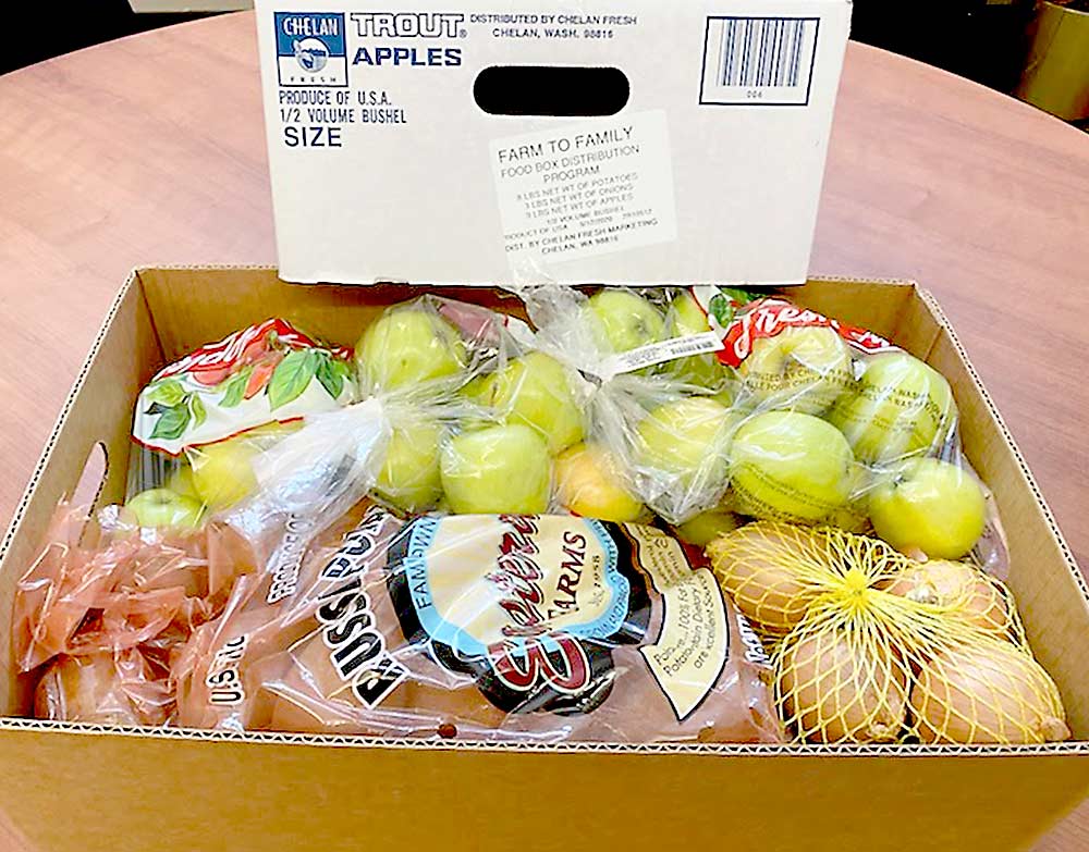 This apple, potato and onion box packed by Chelan Fresh is one of the first the company shipped to nonprofit groups serving families in need as part of the U.S. Department of Agriculture’s pandemic response Farmers to Families Food Box Program. (Courtesy Bryan Peebles)