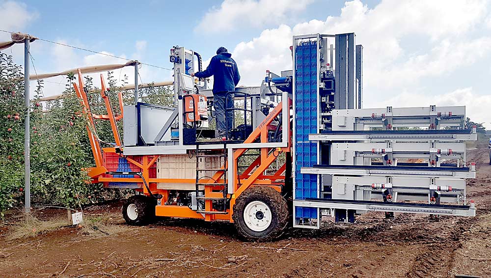 Fresh Fruit Robotics conducted harvest trials in Israel in 2020. The apple picking arms and conveyors on the back of the machine are where the company’s expertise comes in, but the company has partnered with platform and bin-loading equipment manufacturers to commercialize its technology, said CEO Avi Kahani. That’s the sort of ag tech collaboration Western Growers hopes to spur with its new automation initiative. (Courtesy Fresh Fruit Robotics)