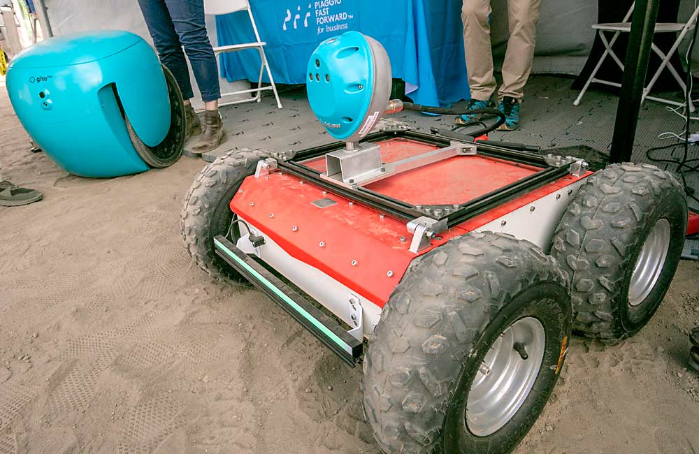 Automated mobility was a hot topic at FIRA. This detachable “head” from Italian vehicle manufacturer Piaggio can make many vehicles autonomous enough to follow a person and remember a route. Tech-oriented families in California’s Bay Area sometimes use the Gita, the blue robot at left, in a similar way to follow trick-or-treaters. (TJ Mullinax/Good Fruit Grower)