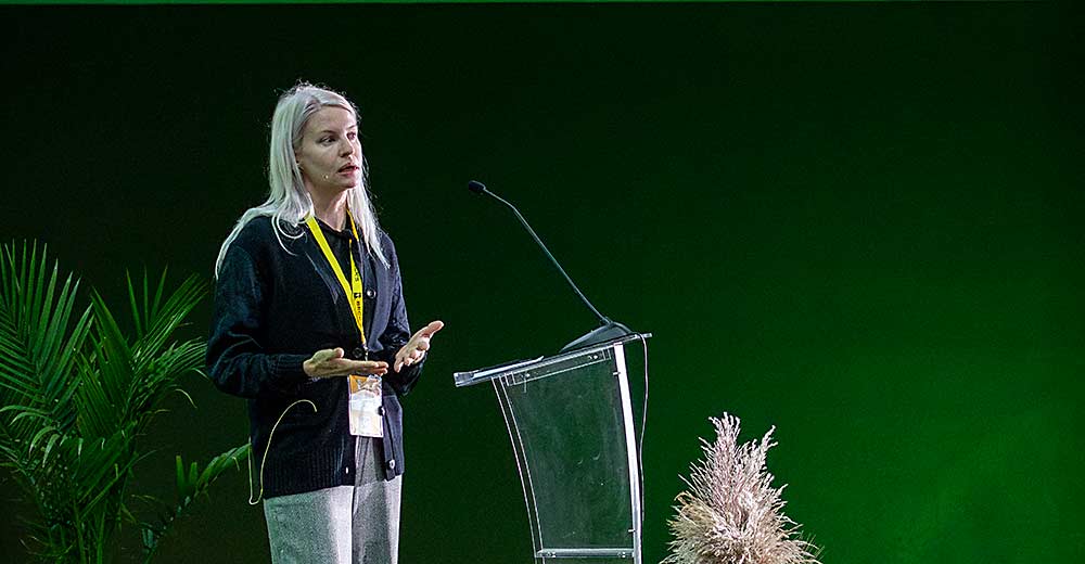 Jennifer Marston, global ag tech editor for AgFunder, delivers the keynote speech at the FIRA USA automation conference in September in Salinas, California. (TJ Mullinax/Good Fruit Grower)