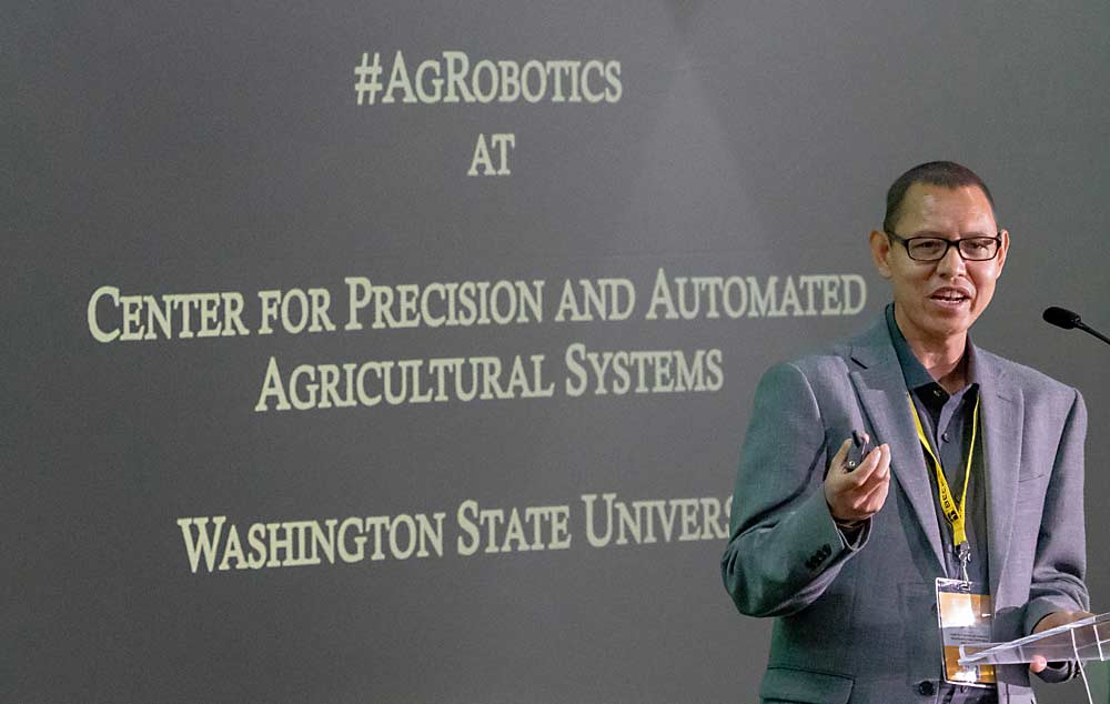 Manoj Karkee, the new director of Washington State University’s Center for Precision and Automated Agricultural Systems, talks about agricultural robotics research during the 2023 FIRA USA conference and equipment trade show at the Salinas Sports Complex in Salinas, California, in September. (TJ Mullinax/Good Fruit Grower)