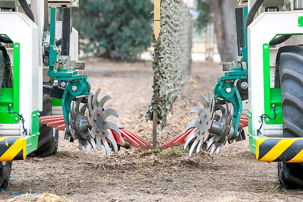 The autonomous Ted vineyard weeder displays its weeding implements during the 2023 FIRA USA conference and trade show in Salinas, California, in September. (TJ Mullinax/Good Fruit Grower)