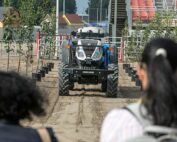 A driverless tractor creeps up a simulated orchard row during a robotics demonstration Sept. 20 at the FIRA USA agricultural automation conference and trade show in Salinas, California. (TJ Mullinax/Good Fruit Grower)
