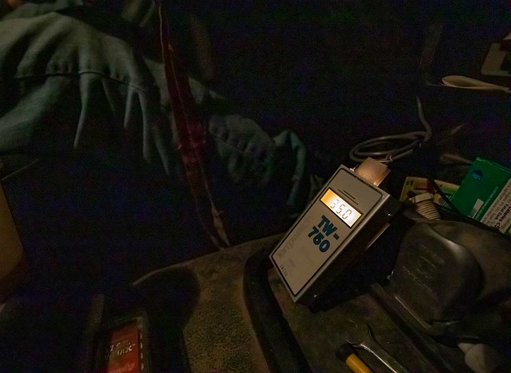 During his cold night shifts, Duim watches the reading on this Tempwatch thermometer in his truck, connected to a sensor on the antenna, which enables him to assess the inversion conditions. On this April night, the higher spots in the orchard were 35 degrees Fahrenheit, while the low spots hit 24 degrees. “I can get a good baseline for what my wind machines are doing,” he said. (TJ Mullinax/Good Fruit Grower)
