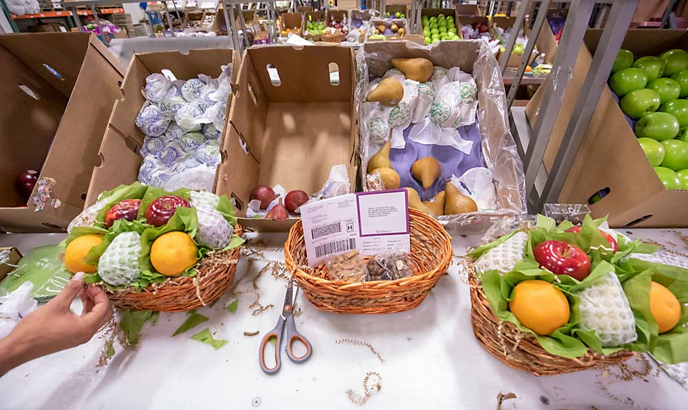 While online cherry sales are all about speed and efficiency, the gift boxes at A Gift Inside require presentation at the assembly tables in the company’s five U.S. warehouses, including the flagship in Lodi, pictured. (TJ Mullinax/Good Fruit Grower)