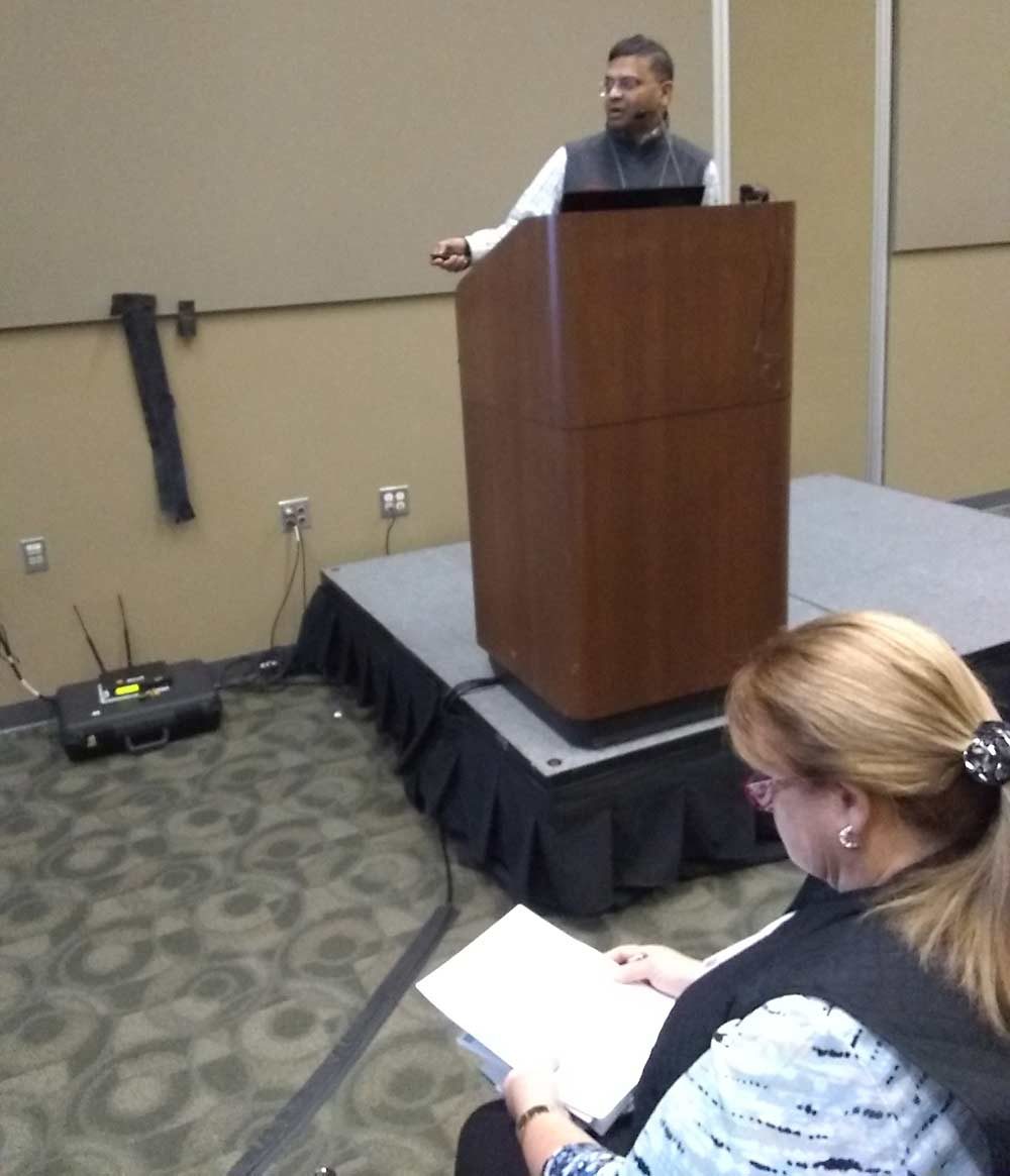 Hemant Gohil discusses New Jersey peach and nectarine varieties at the EXPO on Dec . 11. (Matt Milkovich/Good Fruit Grower)