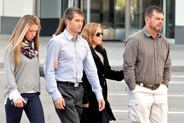 Eric Jensen, 37, right and Ryan Jensen, 33, brothers who owned and operated Jensen Farms,  arrive at the federal courthouse in Denver, on Tuesday, Oct. 22, 2013, with family. The two Colorado farmers whose cantaloupes were tied to a 2011 listeria outbreak that killed 33 people pleaded guilty on Tuesday to misdemeanor charges under a deal with federal prosecutors. (courtesy Ed Andrieski/Associated Press)