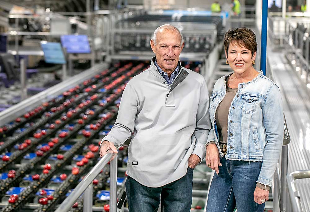 “Having the privilege to work for him and with him was an honor,” Jill Douglas, right, said of her uncle, Bill Douglas, who hired her as general manager of the packing company in 1989. “He’s an amazing businessman and he does not micromanage. He lets you do the job and teaches you as you go.” (TJ Mullinax/Good Fruit Grower)