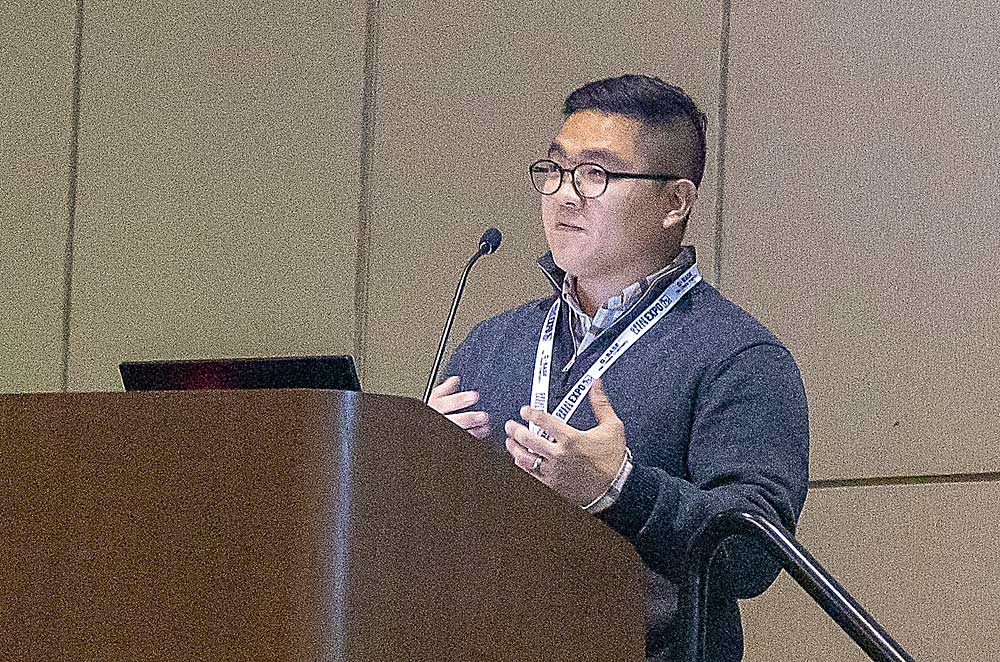 MSU irrigation specialist Younsuk Dong discusses soil moisture sensors and drip irrigation during the Great Lakes Fruit, Vegetable, and Farm Market EXPO in December. (Matt Milkovich/Good Fruit Grower)