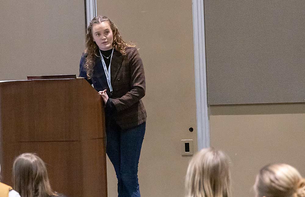 Lab manager Lauren Goldstein answers questions about blueberry pollination during the Great Lakes Fruit, Vegetable, and Farm Market EXPO in Grand Rapids, Michigan, in December. (Matt Milkovich/Good Fruit Grower)