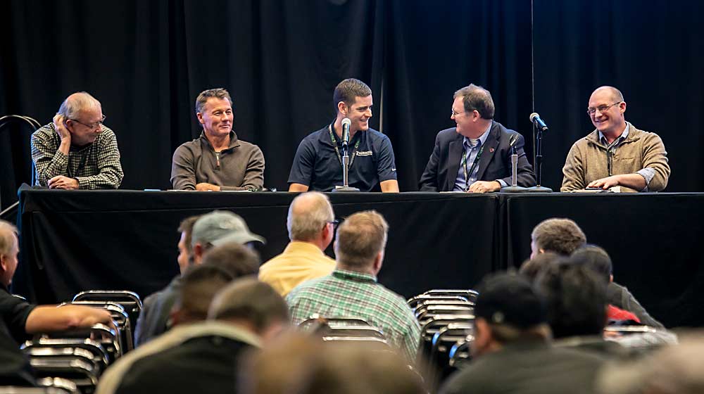 From left, Bruce Allen, Paul Stiekema, Nick Plath, Jason Matson and Jake Gutzwiler speak on the "Harvest management and orchard practices influencing fruit quality" panel during the Washington State Tree Fruit Association's annual meeting in December 2018 in Yakima, Washington. (TJ Mullinax/Good Fruit Grower)
