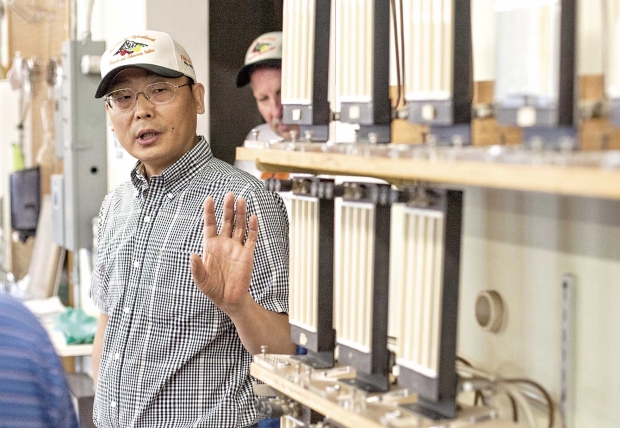 Oregon State University researcher, Yan Wang, talks about the post harvest lab instrumentation on Aug. 8, 2013 in Hood River, Ore.. Wang spoke during a tour during the centennial celebration at the Mid-Columbia Agricultural Research and Extension Center.  (TJ Mullinax/Good Fruit Grower)