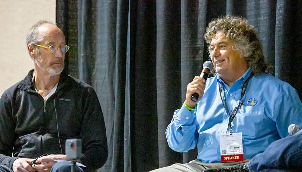 Dain Craver, right, speaks during the labor and technology session with Jim McFerson of Washington State University in 2017 at the Washington State Tree Fruit Association Annual Meeting in Kennewick. (TJ Mullinax/Good Fruit Grower)