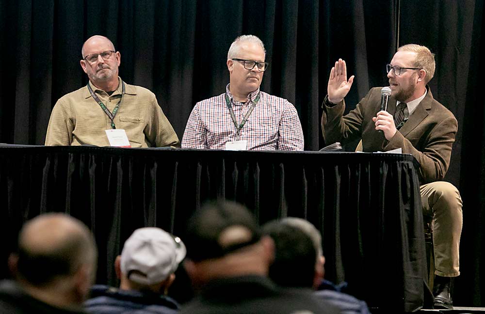 At right, Jacob Klaus, orchard manager for Gilbert Orchards, talks about optimizing crop load for crop value, not volume, during a session on profitability in tough times at the Washington State Tree Fruit Association’s annual meeting in December. With him on the panel are Shawn Tweedy of Chiawana Orchards, center, and Keith Oliver of Olsen Bros. (TJ Mullinax/Good Fruit Grower)