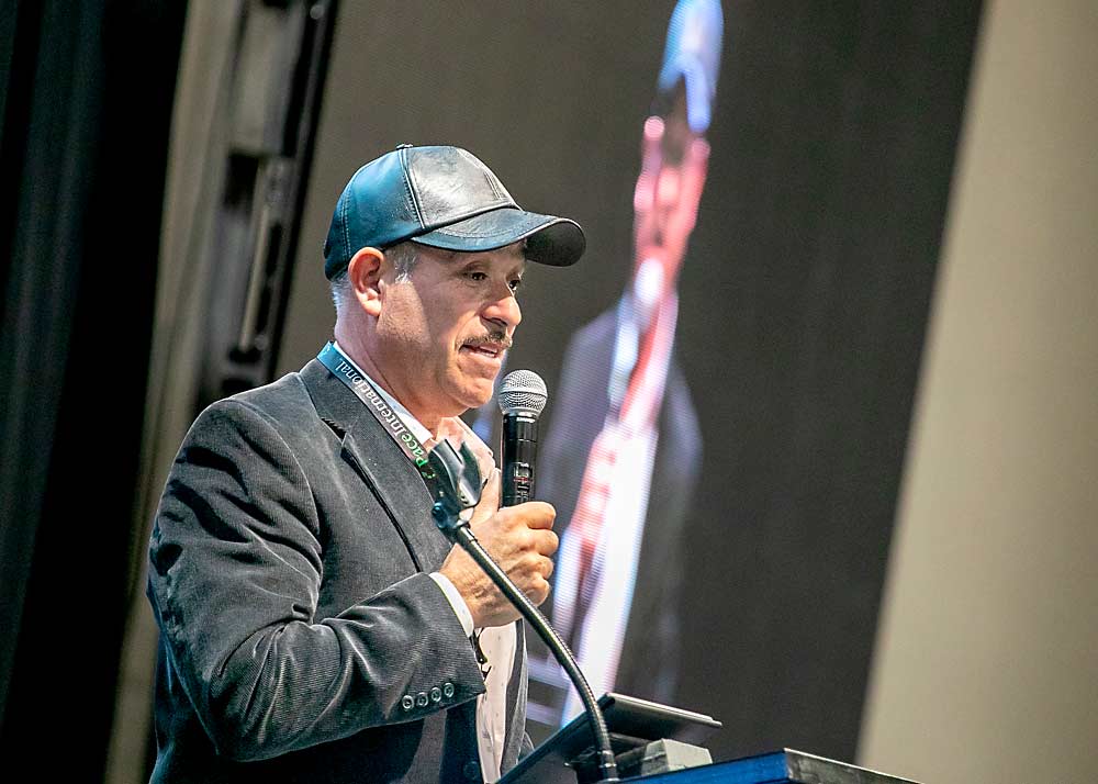 Ofelio Borges speaks at the Spanish-language session of the Washington State Tree Fruit Association’s annual meeting in Kennewick, Washington, Dec. 5. (TJ Mullinax/Good Fruit Grower)