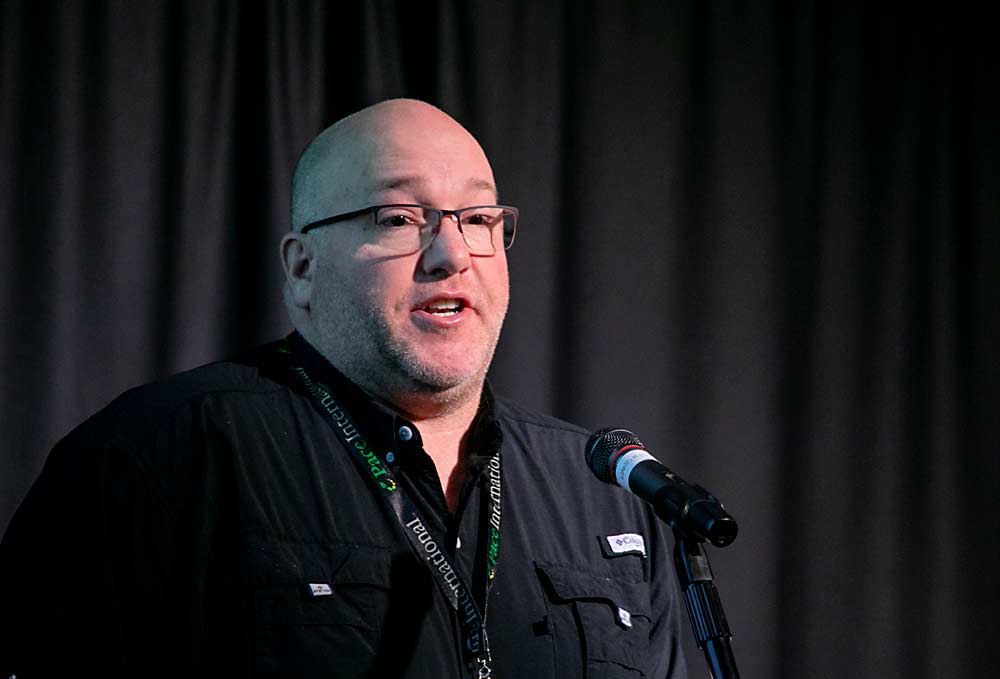 Bradley Farrar of the Washington State Department of Labor and Industries speaks about suggested permanent heat and smoke rules in December at the Washington State Tree Fruit Association Annual Meeting in Wenatchee. (TJ Mullinax/Good Fruit Grower)