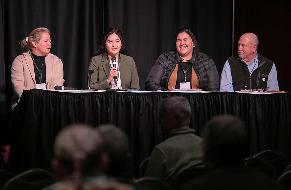 From left: Sarah Wixson, attorney with Stokes Lawrence law firm in Yakima; Flor Maldonado of M&A Orchards in Tonasket; Chafeka Abdellatif, human resources director at Kershaw Cos.; and Corwyn Fischer, assistant safety and claims director at the Washington Farm Bureau, discuss labor safety in December at the Washington State Tree Fruit Association Annual Meeting in Wenatchee. (TJ Mullinax/Good Fruit Grower)