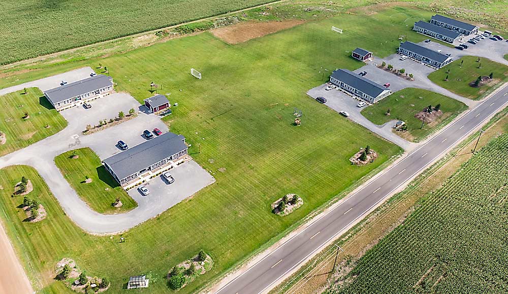 To solve a local housing shortage and retain employees, fruit processor Peterson Farms built its own housing complex called Oceana Acres, seen here. Located near the Peterson Farms campus in Oceana County, Michigan, the 56 apartments currently house 137 people. (Courtesy Peterson Farms)