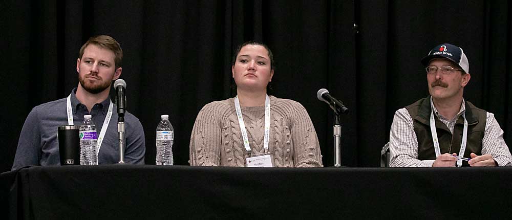 From left: Growers Gilbert Plath, Kristen DeMarree, and Matt Miles address their experience with vision systems so far. (TJ Mullinax/Good Fruit Grower)