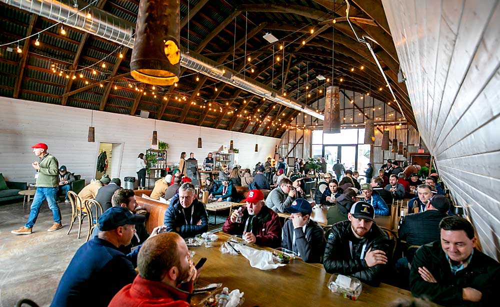 Tourgoers break for lunch in the tasting room of Gilbert Cellars, also owned by Sean Gilbert’s family. (TJ Mullinax/Good Fruit Grower)