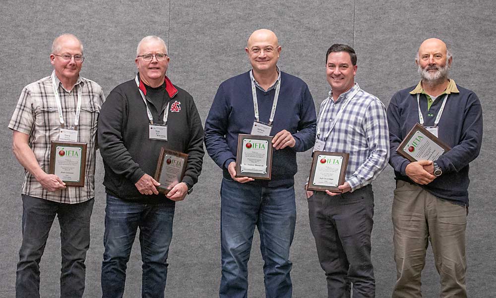 Industry leaders honored at the International Fruit Tree Association conference in Yakima, Washington, Feb. 14, from left to right: Dave Gleason, Outstanding Grower Award; Tom Auvil, Lifetime Achievement Award; Stefano Musacchi, Outstanding Researcher Award; Jeff Cleveringa, Industry Service Award; and Mauricio Frias, Outstanding Extension Educator Award. (TJ Mullinax/Good Fruit Grower)