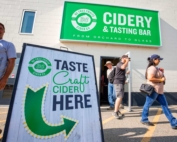 International Fruit Tree Association tour attendees depart a hard cider tasting session highlighting BC Tree Fruits' business decision to open a cider processing facility, utilizing the company's cull fruit at their Kelowna, British Columbia, packing facility on July 24, 2018. (TJ Mullinax/Good Fruit Grower)