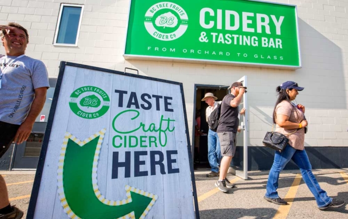 International Fruit Tree Association tour attendees depart a hard cider tasting session highlighting BC Tree Fruits' business decision to open a cider processing facility, utilizing the company's cull fruit at their Kelowna, British Columbia, packing facility on July 24, 2018. (TJ Mullinax/Good Fruit Grower)