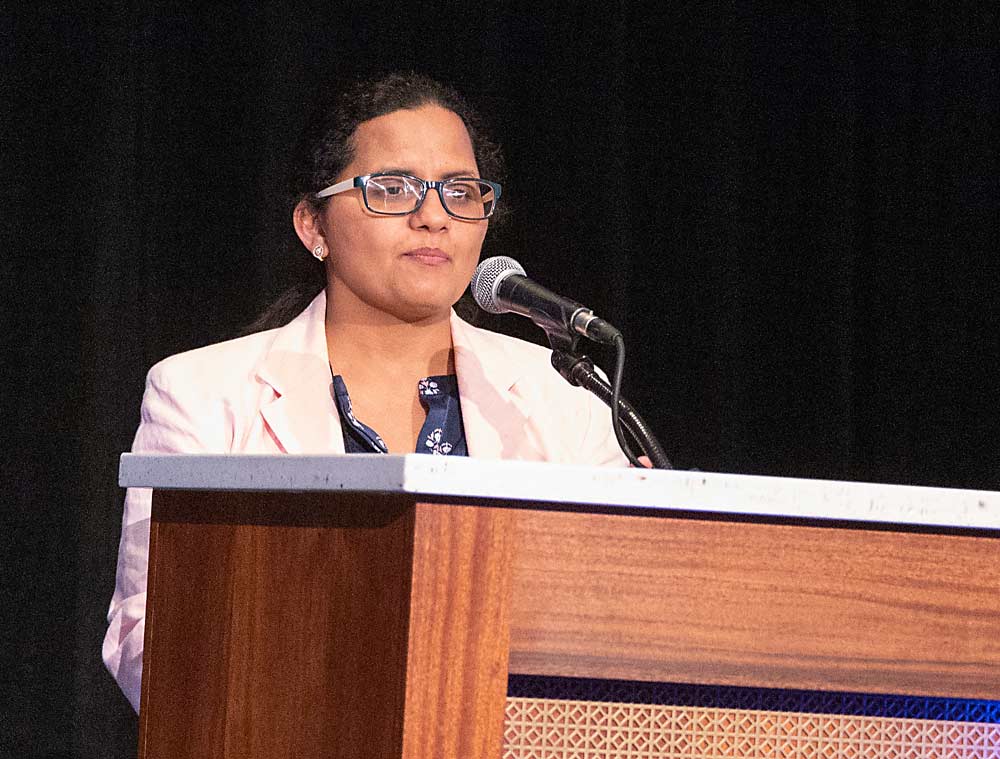 Michigan State University weed scientist Sushila Chaudhari discusses her study of the WEED-IT Quadro precision herbicide sprayer during the International Fruit Tree Association’s conference in Grand Rapids, Michigan, in February. (Matt Milkovich/Good Fruit Grower)