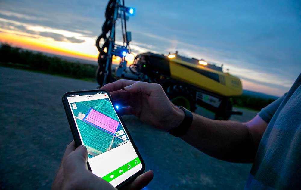 Chris Bartlett of Provide Agro selects a block to be sprayed — highlighted in pink — in the app that operates the autonomous AgBot sprayer developed by two Dutch companies, AgXeed and Hol Spraying Systems. This demonstration, done for the International Fruit Tree Association in Nova Scotia in July, is part of the industry’s ongoing interest in giving task maps to such precision sprayers as the next step in the iterations of precision agriculture. (TJ Mullinax/Good Fruit Grower)
