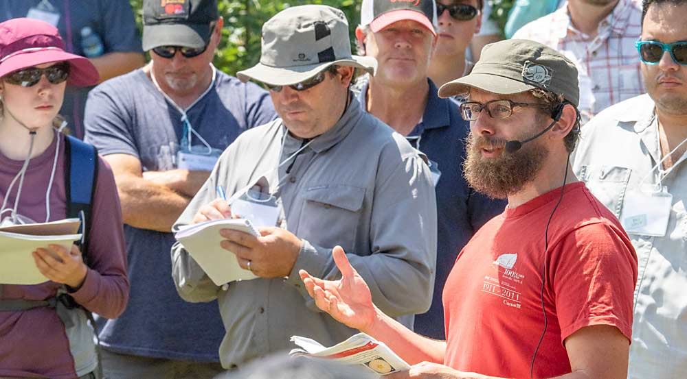 Harrison Wright, a research scientist with Agriculture and Agri-Food Canada, discussed the effects of anti-ethylene products on Ambrosia and Honeycrisp in storage at Van Meekeren Farms during the International Fruit Tree Association’s tour of Nova Scotia in July 2023. (TJ Mullinax/Good Fruit Grower)