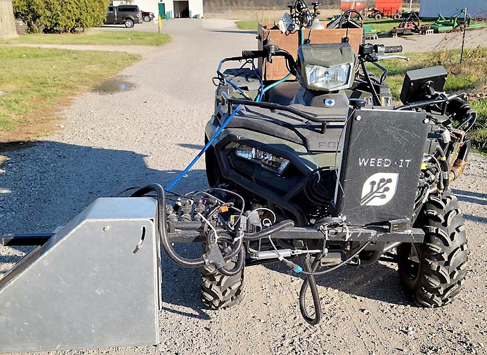 A WEED-IT Quadro herbicide sprayer attached to an ATV at the Michigan State University campus research farm. The Quadro uses sensors to detect weeds based on their chlorophyll fluorescence. (Courtesy Sushila Chaudhari/Michigan State University)
