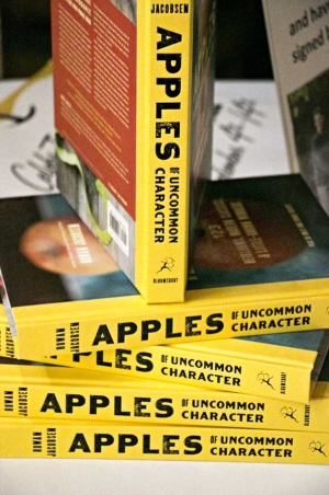 A stack of "Apples of Uncommon Character” by Rowan Jacobsen are arranged during his book tour visit in Yakima. (TJ Mullinax/Good Fruit Grower)