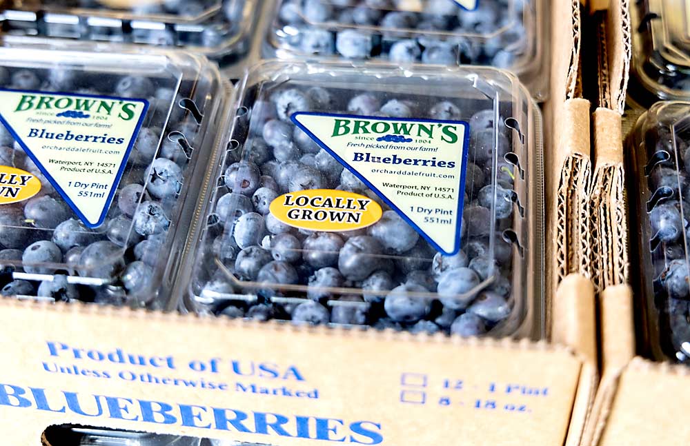 At Orchard Dale Fruit Co., grower Robert Brown’s 12 acres of blueberries are hand harvested and field packed in plastic clamshells with a Brown’s Blueberries label. Blueberry sales to local grocers are a limited niche, but their per-acre value rivals Honeycrisp apples, Brown said. (Matt Milkovich/Good Fruit Grower)