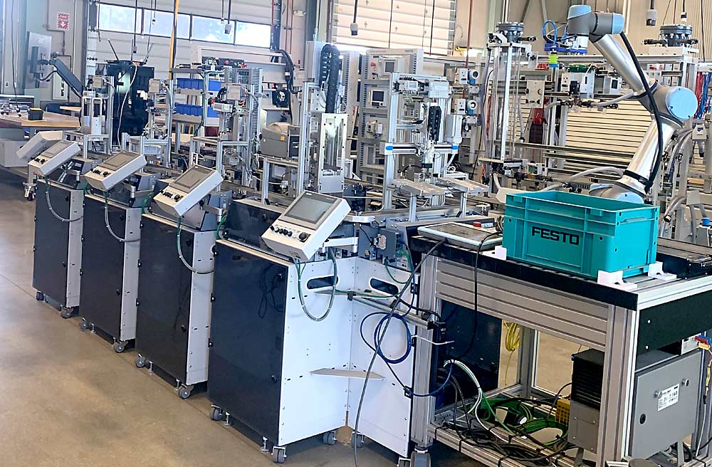 The mechatronics workshop at Hartnell College includes this miniature fresh produce packing line, operated by the same computer programs as the full-sized versions in nearby workplaces. (Courtesy Hartnell College)