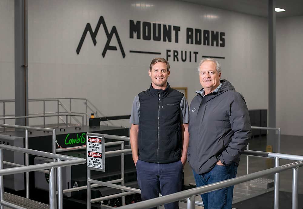 Don Gibson, company president, right, and his son, Doug, vice president, steered Mount Adams through the rebuild. Doug Gibson leaned on his technology industry background in the process. (TJ Mullinax/Good Fruit Grower)