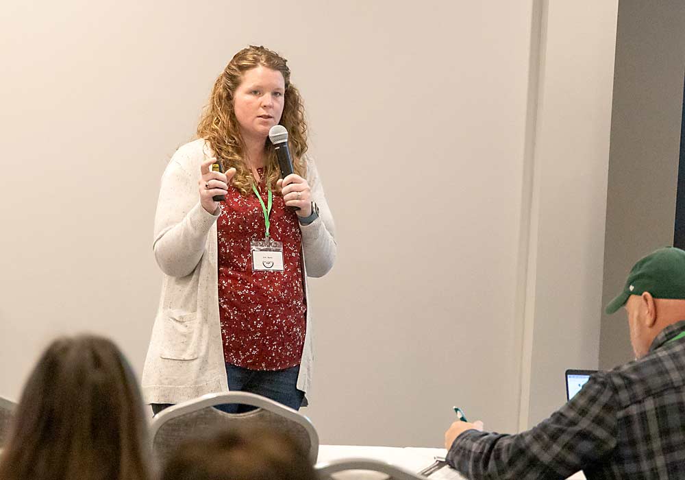 Michigan State University weed scientist Erin Burns talks integrated weed management at the MSU Fruit School in Okemos in February. Burns, who normally works with row crops, said perennial crops such as fruit require a somewhat different management approach than annual crops. (Matt Milkovich/Good Fruit Grower)