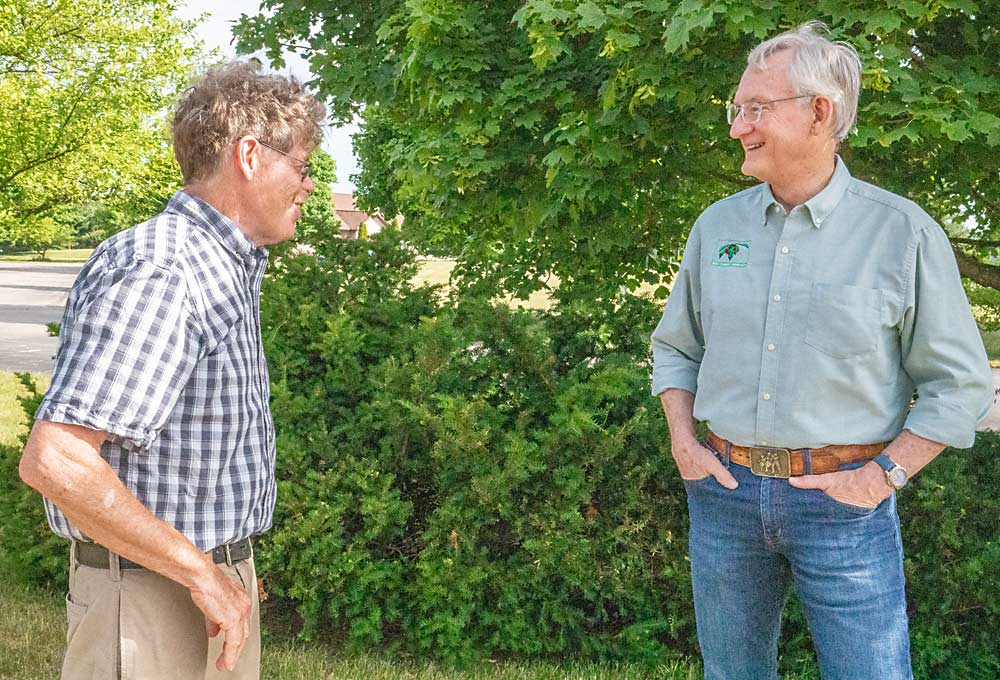 Michigan State University researchers Bill Shane, left, and Greg Lang are studying different pruning methods for stone fruit, seeking to find the right balance of fruit, wood and leaf area for two-dimensional canopies. (TJ Mullinax/Good Fruit Grower)