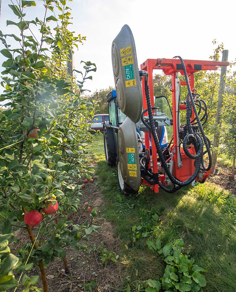 The Slaybaughs use an Olmi pneumatic defoliator to strip leaves and expose Honeycrisp to sunlight in September for better coloring. David said the machine’s dual heads cut a big swath down the row. (TJ Mullinax/Good Fruit Grower)
