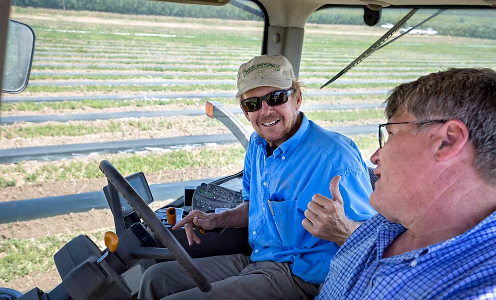 Robinson and Jim Baird, his partner in BMR Orchards, chat during a break from tilling mustard seed meal into tree rows at the site of a 2017 experiment with fumigation alternatives in the Columbia Basin. (TJ Mullinax/Good Fruit Grower)