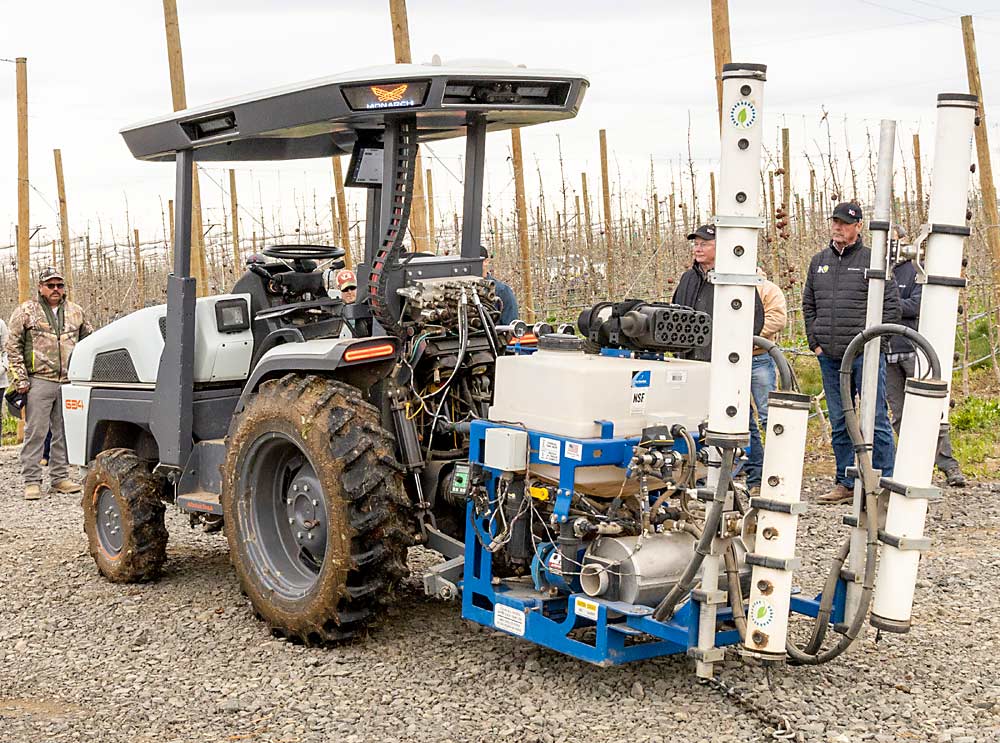 Monarch bills its tractors as driver-optional, so the cab features all the controls growers expect, but with the flip of a switch a remote operator can manage a small fleet, separating people from spray applications and increasing labor efficiency, the company said during a Washington demo. (Kate Prengaman/Good Fruit Grower)