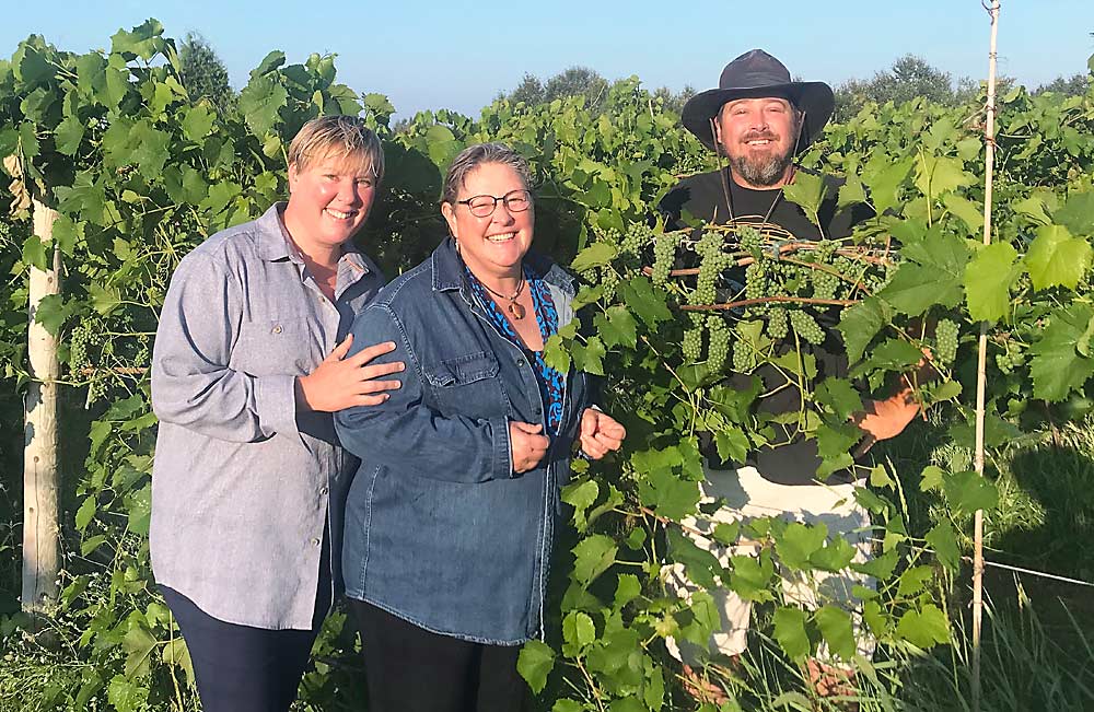 From left: new Northern Sun Winery co-owners Melissa and Wendy Middaugh with vineyard manager and winemaker Jonathan Bovard. They make all of their wines from grapes grown in their on-site vineyards. (Courtesy Northern Sun Winery)
