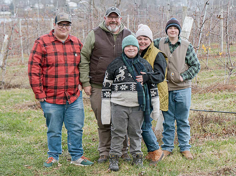 The Teeple family at their orchard in Wolcott, New York. From left are Jackson, Frank, Levi, Danielle and Philip. They strive to make their farm a place where everyone feels welcome. (Courtesy Hannah Eygnor)