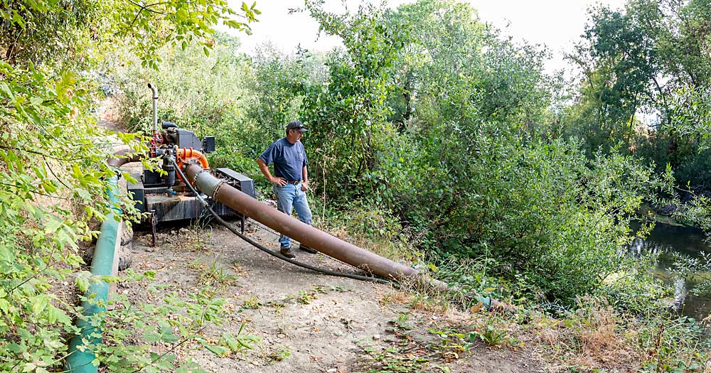 Kurt Ashurst’s irrigation pump sits idle in August on the banks of the Russian River. Historically, floods have been a bigger problem than drought in the area, but in August 2021 water authorities completely cut off Ashurst and other growers who typically draw straight from the river. (TJ Mullinax/Good Fruit Grower)