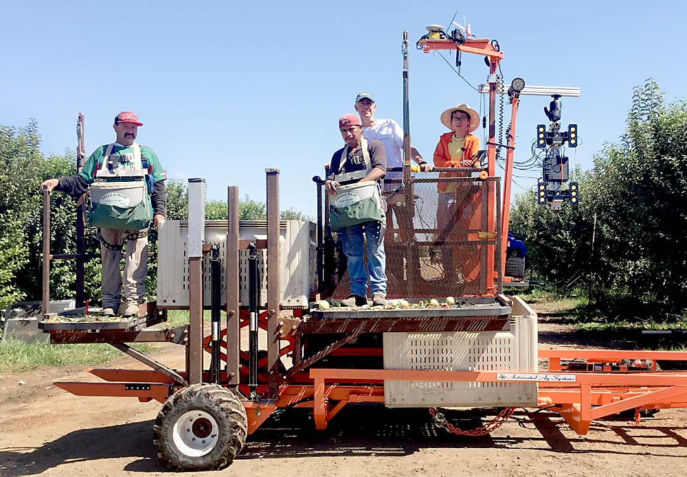 Robotics researchers at the University of California, Davis have developed a prototype of a co-robotic platform that uses computer vision to automatically move pickers up and down to the most efficient harvest levels as they move along the two-dimensional tree canopy. (Courtesy Stavros Vougioukas/ University of California Davis)