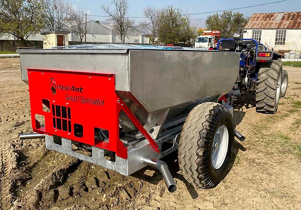 The Smart Spreader from Red Ant Agricultural Equipment of South Africa follows a task map to apply variable rates of fertilizer through an orchard. Red Ant designed this model specifically for the U.S. market, with a larger hopper and the ability to apply two products in one pass, to save on labor costs, according to engineer James Reid. (Courtesy James Reid/Red Ant Agricultural Equipment)