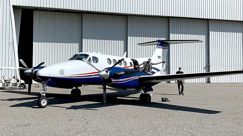 A King Air B200 aircraft at Burbank Airport preps for a vineyard flight. On board is an AVIRIS instrument invented by NASA’s Jet Propulsion Laboratory. As the plane flies over California vineyards, the instrument makes a hyperspectral map, studying the way light interacts with objects, including grape leaves. (Courtesy Katie Gold/Cornell University)